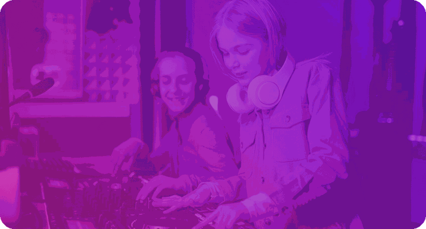 General music teacher djing with student.