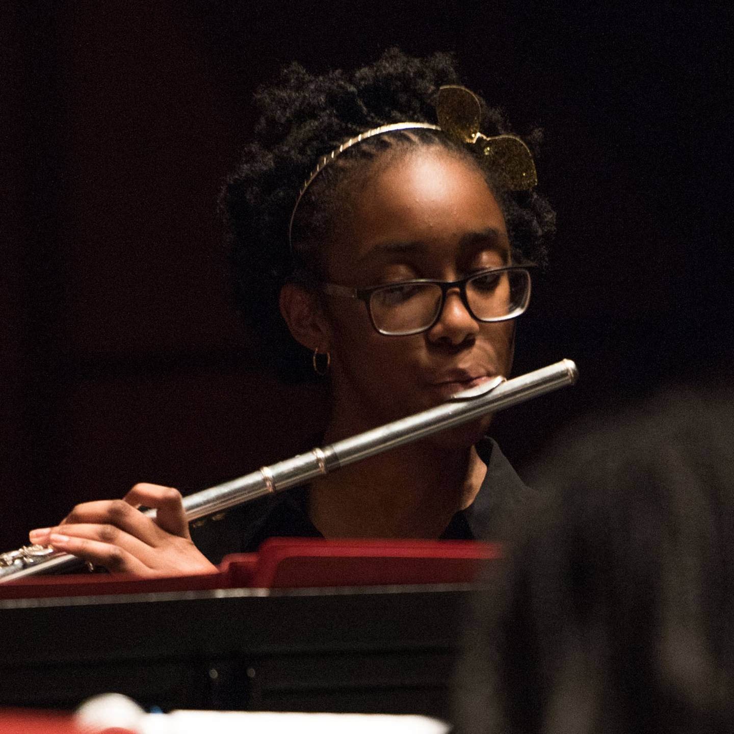 a child playing a flute